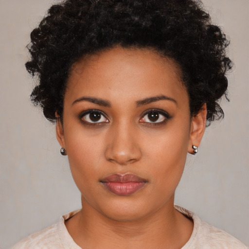 Neutral black young-adult female with short  black hair and brown eyes