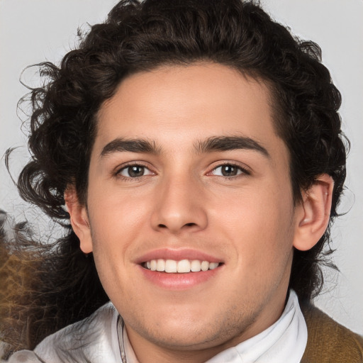 Joyful white young-adult male with medium  brown hair and brown eyes