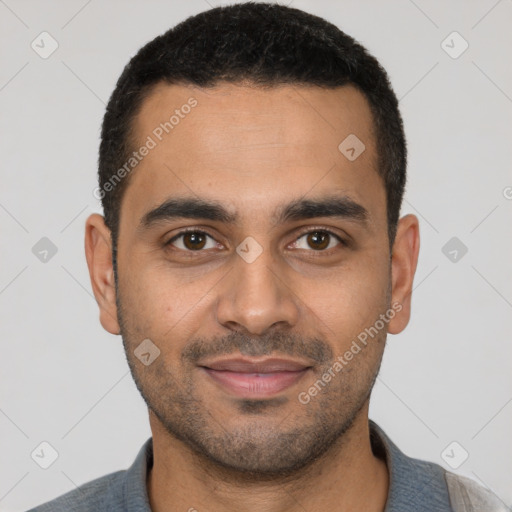 Joyful latino young-adult male with short  black hair and brown eyes