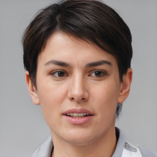 Joyful white young-adult female with short  brown hair and brown eyes