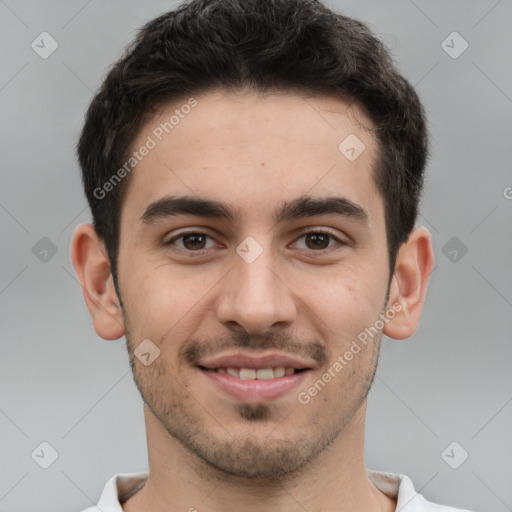 Joyful white young-adult male with short  brown hair and brown eyes