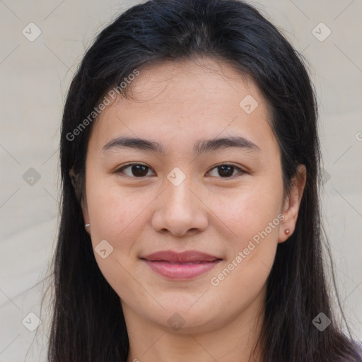 Joyful asian young-adult female with long  brown hair and brown eyes