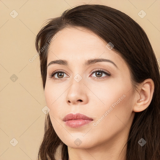 Neutral white young-adult female with long  brown hair and brown eyes