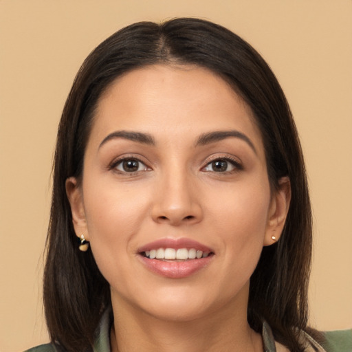 Joyful white young-adult female with long  brown hair and brown eyes