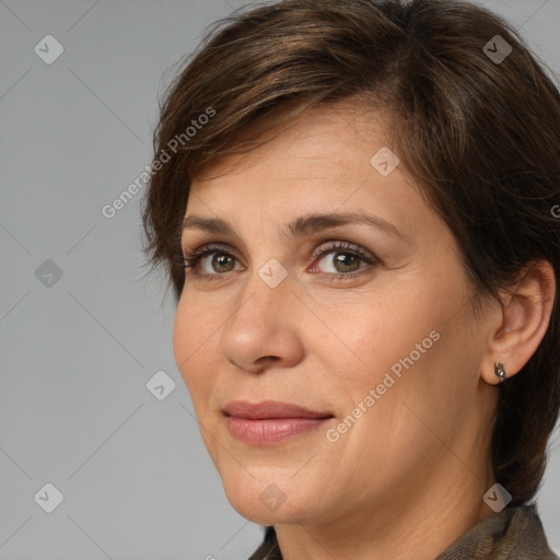 Joyful white adult female with medium  brown hair and brown eyes