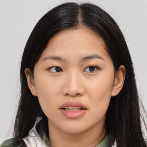 Joyful white young-adult female with long  black hair and brown eyes