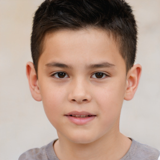 Joyful white child male with short  brown hair and brown eyes