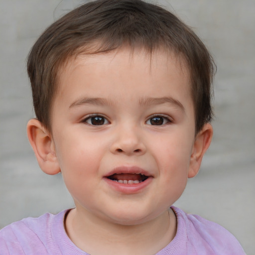 Joyful white child male with short  brown hair and brown eyes