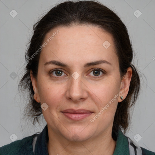 Joyful white adult female with medium  brown hair and grey eyes