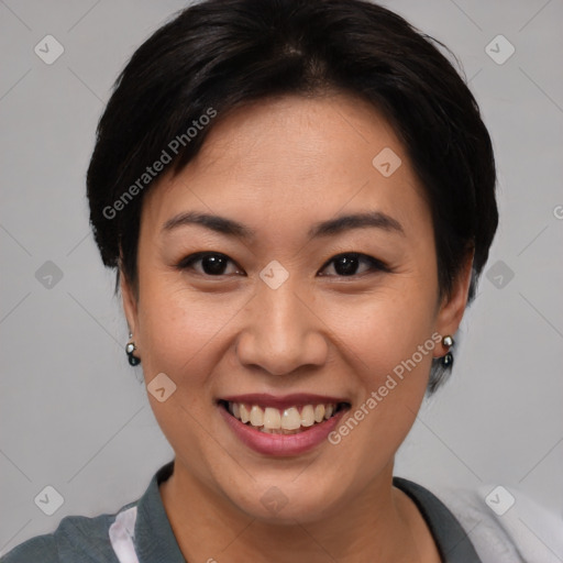 Joyful asian young-adult female with short  brown hair and brown eyes