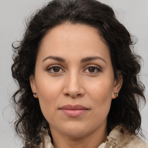 Joyful white adult female with long  brown hair and brown eyes