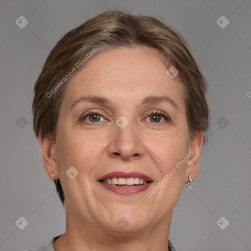 Joyful white adult female with short  brown hair and grey eyes