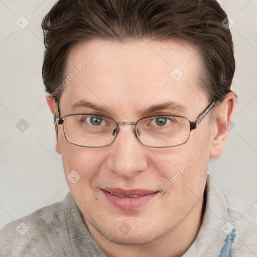 Joyful white adult female with short  brown hair and grey eyes