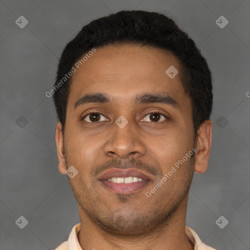 Joyful latino young-adult male with short  brown hair and brown eyes