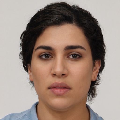 Neutral latino young-adult female with medium  brown hair and brown eyes