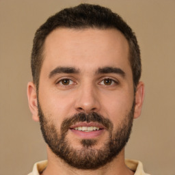 Joyful white young-adult male with short  brown hair and brown eyes