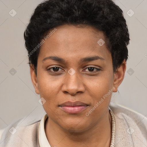 Joyful black young-adult female with short  black hair and brown eyes