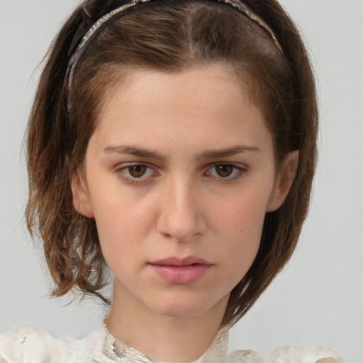 Neutral white young-adult female with medium  brown hair and brown eyes