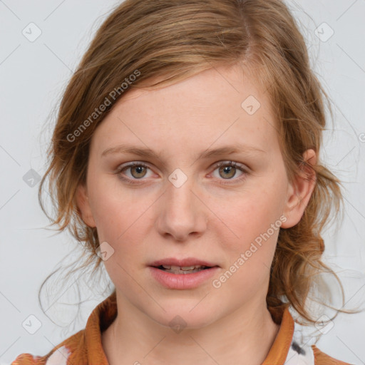 Joyful white young-adult female with medium  brown hair and blue eyes