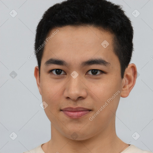 Joyful asian young-adult male with short  black hair and brown eyes