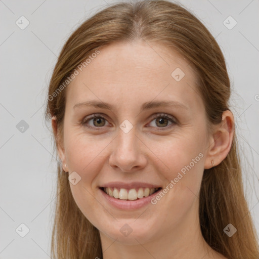 Joyful white young-adult female with long  brown hair and grey eyes