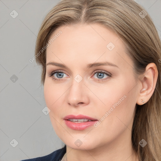 Joyful white young-adult female with long  brown hair and blue eyes