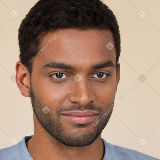 Joyful black young-adult male with short  brown hair and brown eyes