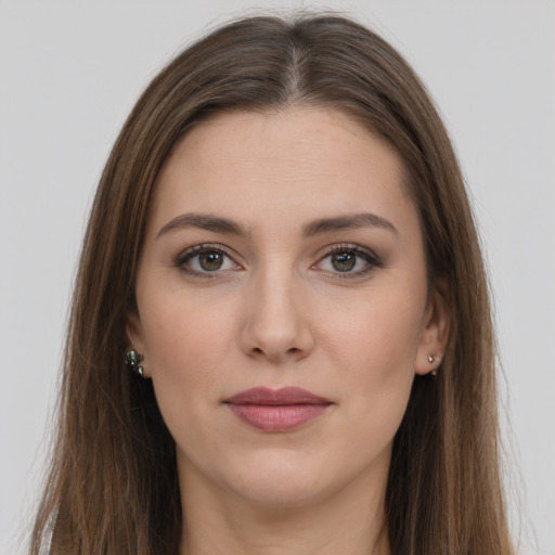 Joyful white young-adult female with long  brown hair and grey eyes