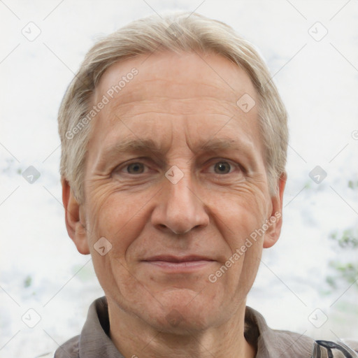 Joyful white middle-aged male with short  gray hair and brown eyes