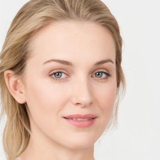 Joyful white young-adult female with long  brown hair and blue eyes