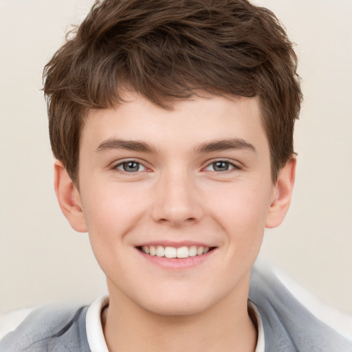 Joyful white child male with short  brown hair and brown eyes