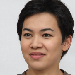 Joyful asian young-adult female with short  black hair and brown eyes