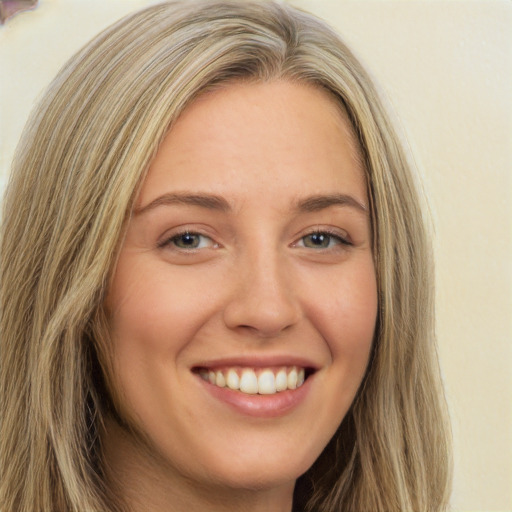 Joyful white young-adult female with long  brown hair and green eyes