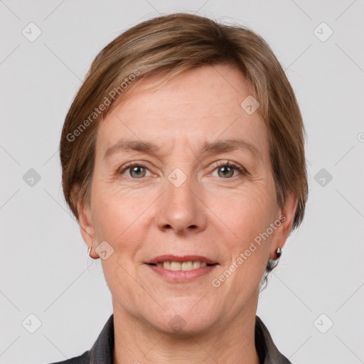 Joyful white adult female with medium  brown hair and grey eyes