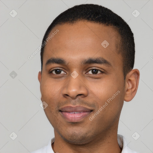 Joyful black young-adult male with short  black hair and brown eyes