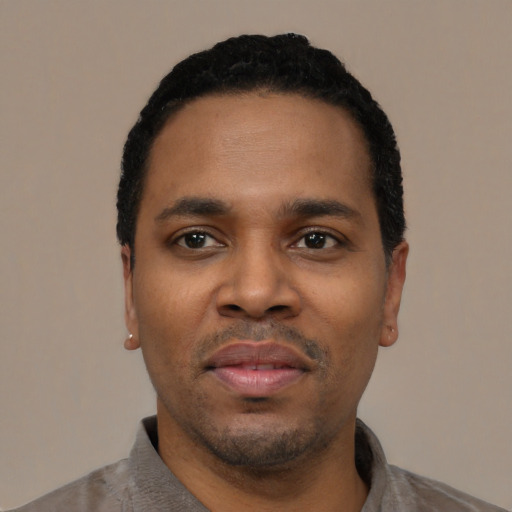 Neutral black young-adult male with short  black hair and brown eyes