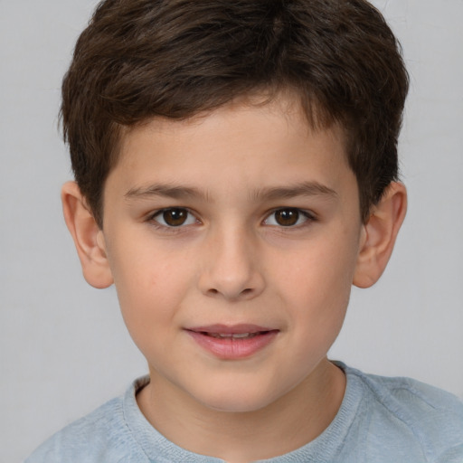 Joyful white child male with short  brown hair and brown eyes