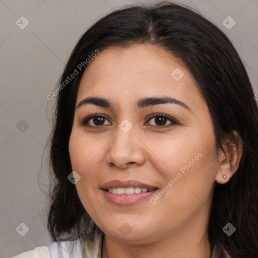 Joyful latino young-adult female with long  brown hair and brown eyes