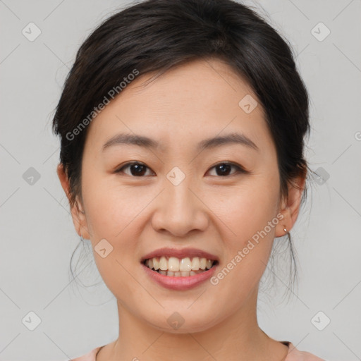 Joyful asian young-adult female with medium  brown hair and brown eyes