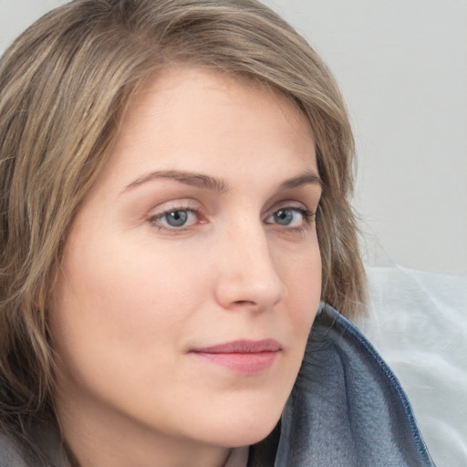 Neutral white young-adult female with long  brown hair and grey eyes