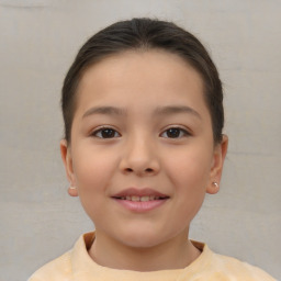 Joyful white child female with short  brown hair and brown eyes