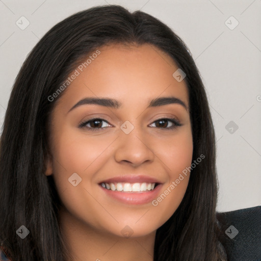 Joyful latino young-adult female with long  brown hair and brown eyes