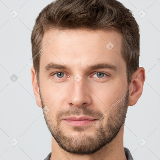 Neutral white young-adult male with short  brown hair and grey eyes