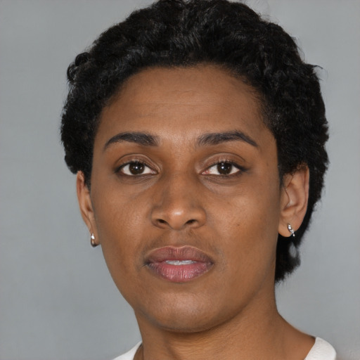 Neutral black young-adult female with short  black hair and brown eyes