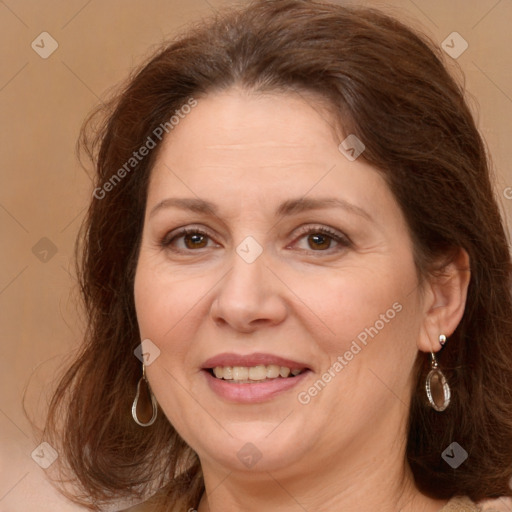 Joyful white adult female with long  brown hair and brown eyes