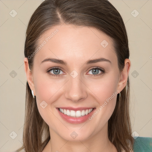 Joyful white young-adult female with long  brown hair and grey eyes