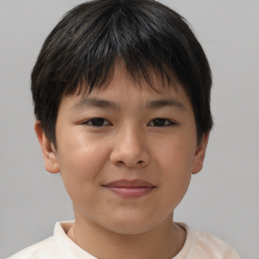 Joyful asian child female with short  brown hair and brown eyes