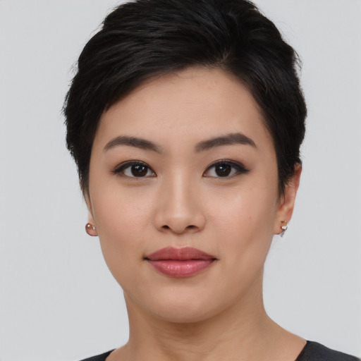 Joyful asian young-adult female with short  black hair and brown eyes