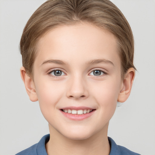 Joyful white child female with short  brown hair and grey eyes