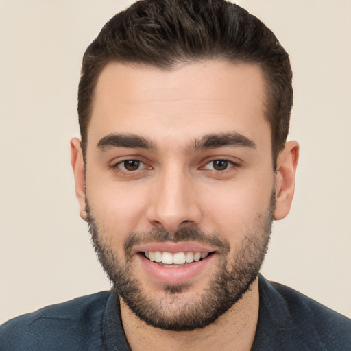 Joyful white young-adult male with short  brown hair and brown eyes